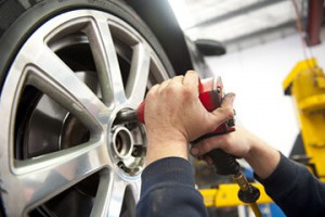 mechanic working tyres and wheel alignment, Oil Change, Complete Auto Repairs, 617 Hillside Road, Forbury Corner, Dunedin